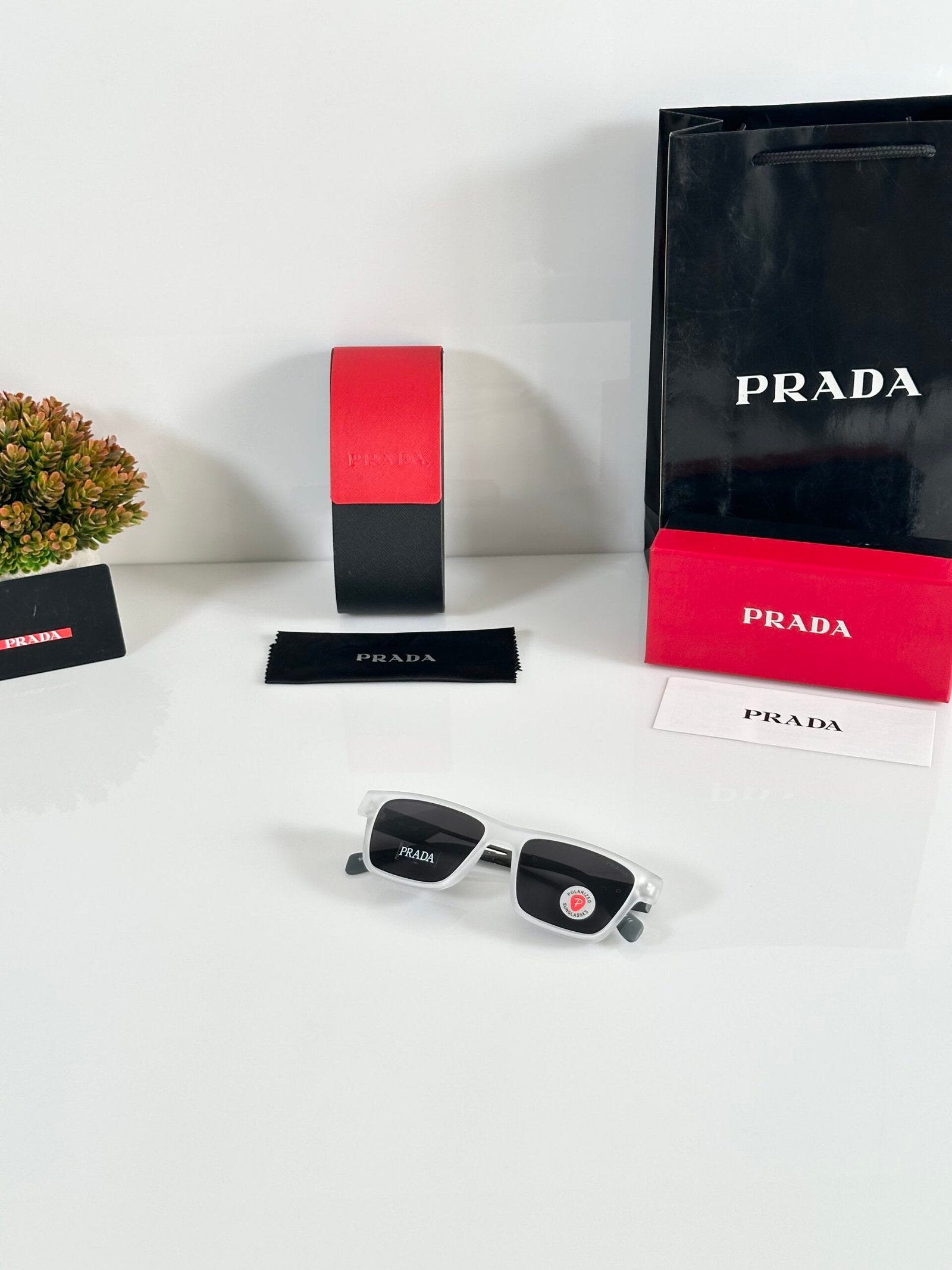 Prada_144_Ice_Black_Grey_Stick